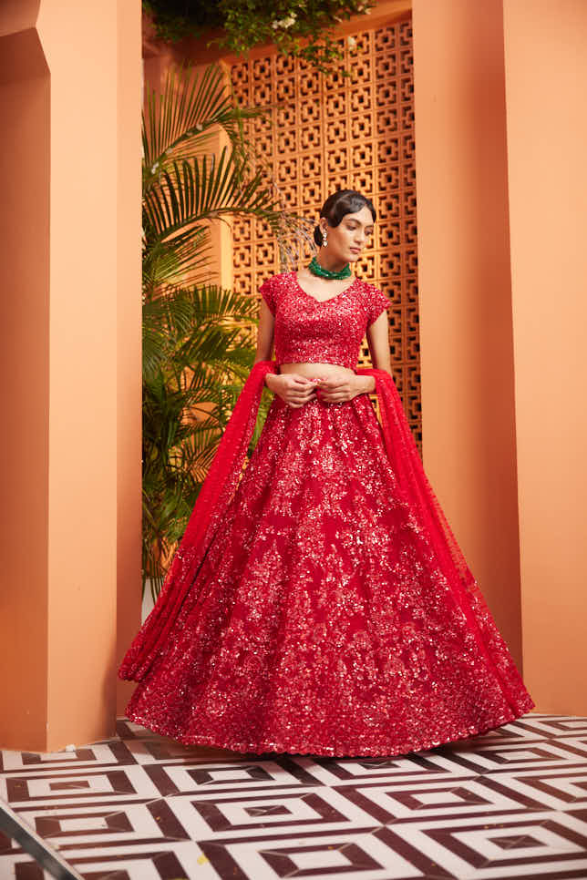 Red heavily embellished lehenga